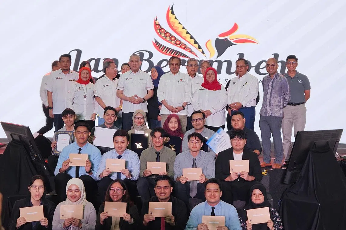 Sarawak premier Abang Johari Openg witnesses the industrial placement offer letters to 34 students by Petronas, Sarawak oil company Petros and Affin Bank in Kuala Lumpur.