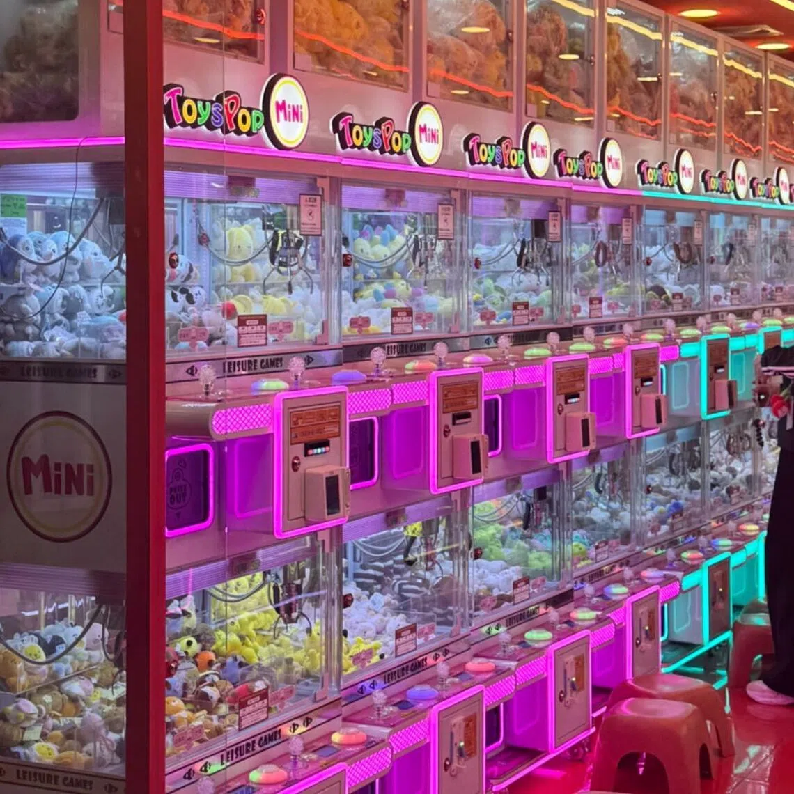 A consumer views claw machines at an arcade inside Jamsil Station on Subway Line Nos. 2 and 8 in Seoul.