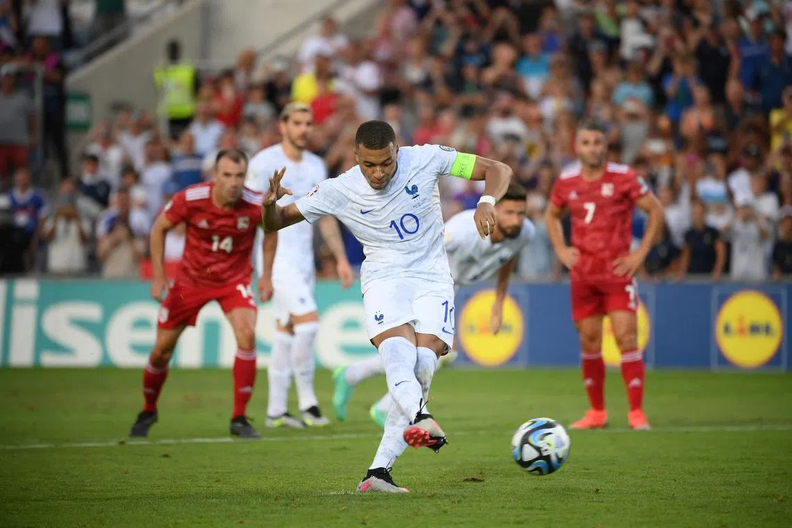France forward Kylian Mbappe scores from the penalty spot in the 3-0 Euro 2024 qualifying win over Gibraltar.
