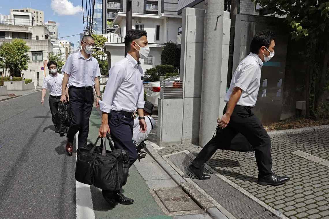Officers of the Tokyo District Public Prosecutors Office enter to search the headquarters of publisher Kadokawa Corp in Tokyo, Japan in this photo taken by Kyodo on September 6, 2022. Kyodo via REUTERS ATTENTION EDITORS - THIS IMAGE WAS PROVIDED BY A THIRD PARTY. MANDATORY CREDIT. JAPAN OUT. NO COMMERCIAL OR EDITORIAL SALES IN JAPAN