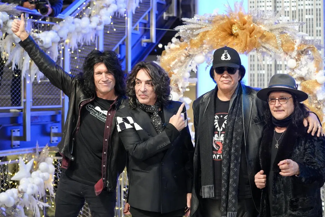 epa11004879 Members of the US rock band Kiss (L-R) Tommy Thayer, Paul Stanley, Gene Simmons, and Eric Singer pose during a lighting ceremony of the Empire State Building in New York, New York, USA, 30 November 2023. The band has announced they are retiring after playing their final two shows from 01 to 02 December at Madison Square Garden in New York.  EPA-EFE/STEPHANI SPINDEL