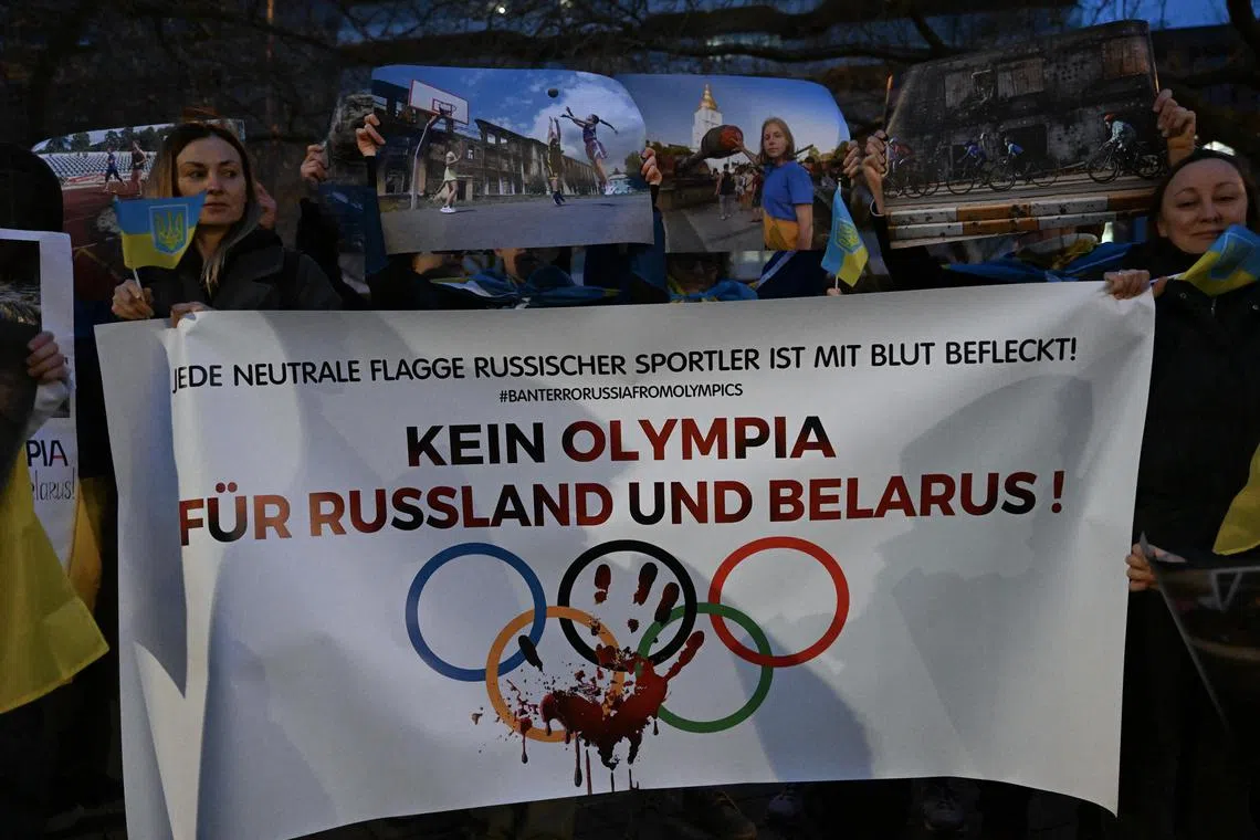 Ukrainian refugees protest against any participation of Russian and Belarusian athletes at the Paris 2024 Olympic Games, in Germany, on March 22, 2023.