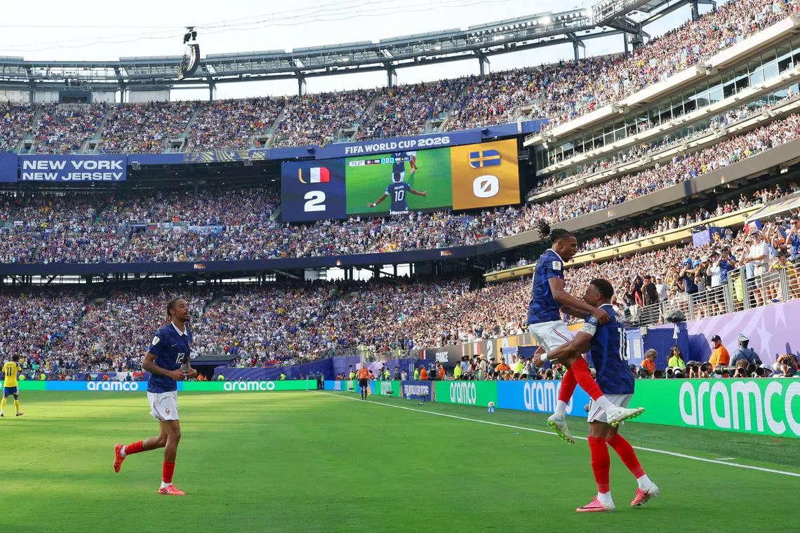 Soccer Football - FIFA World Cup 2026 - Round of 32 - France v Sweden - New York New Jersey Stadium, East Rutherford, New Jersey, U.S. - June 30, 2026 France's Kylian Mbappe celebrates scoring their third goal with Bradley Barcola and Michael Olise IMAGN IMAGES via Reuters/Vincent Carchietta