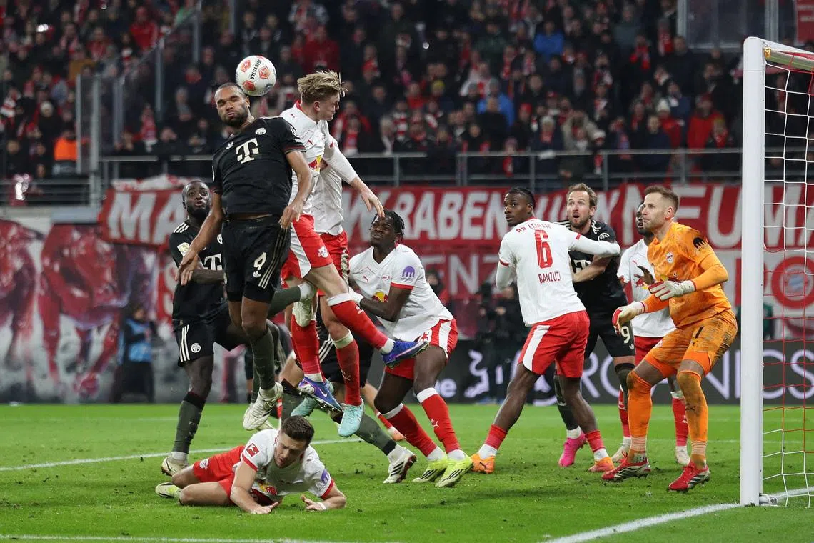 Soccer Football - Bundesliga - RB Leipzig v Bayern Munich - Red Bull Arena, Leipzig, Germany - January 17, 2026 Bayern Munich's Jonathan Tah scores their third goal REUTERS/Maryam Majd