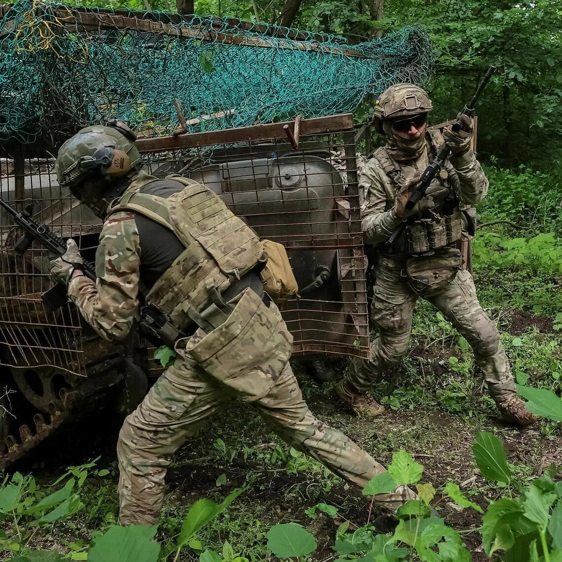 Ukrainian servicemen taking part in a military exercise between combat missions, in Ukraine's Kharkiv region on May 29.