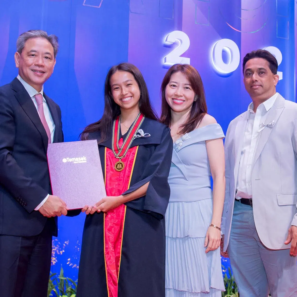 dltpgrad - Ms Portia Gabrielle Karl with her parents at her Temasek Polytechnic graduation ceremony.



Credit: Temasek Polytechnic