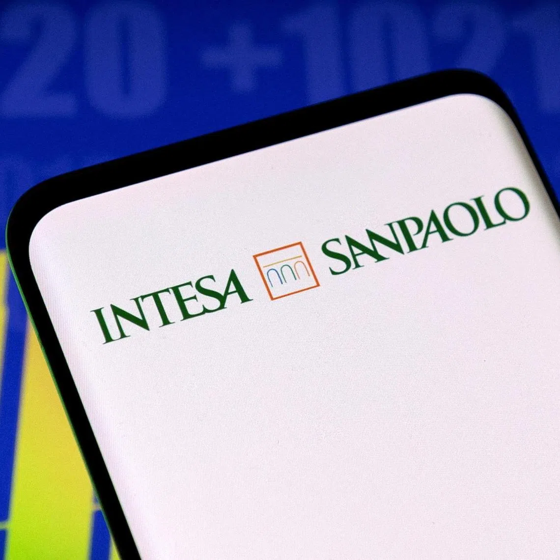 FILE PHOTO: Intesa Sanpaolo bank logo and stock graph are seen displayed in this illustration taken, May 3, 2022. REUTERS/Dado Ruvic/Illustration/File Photo