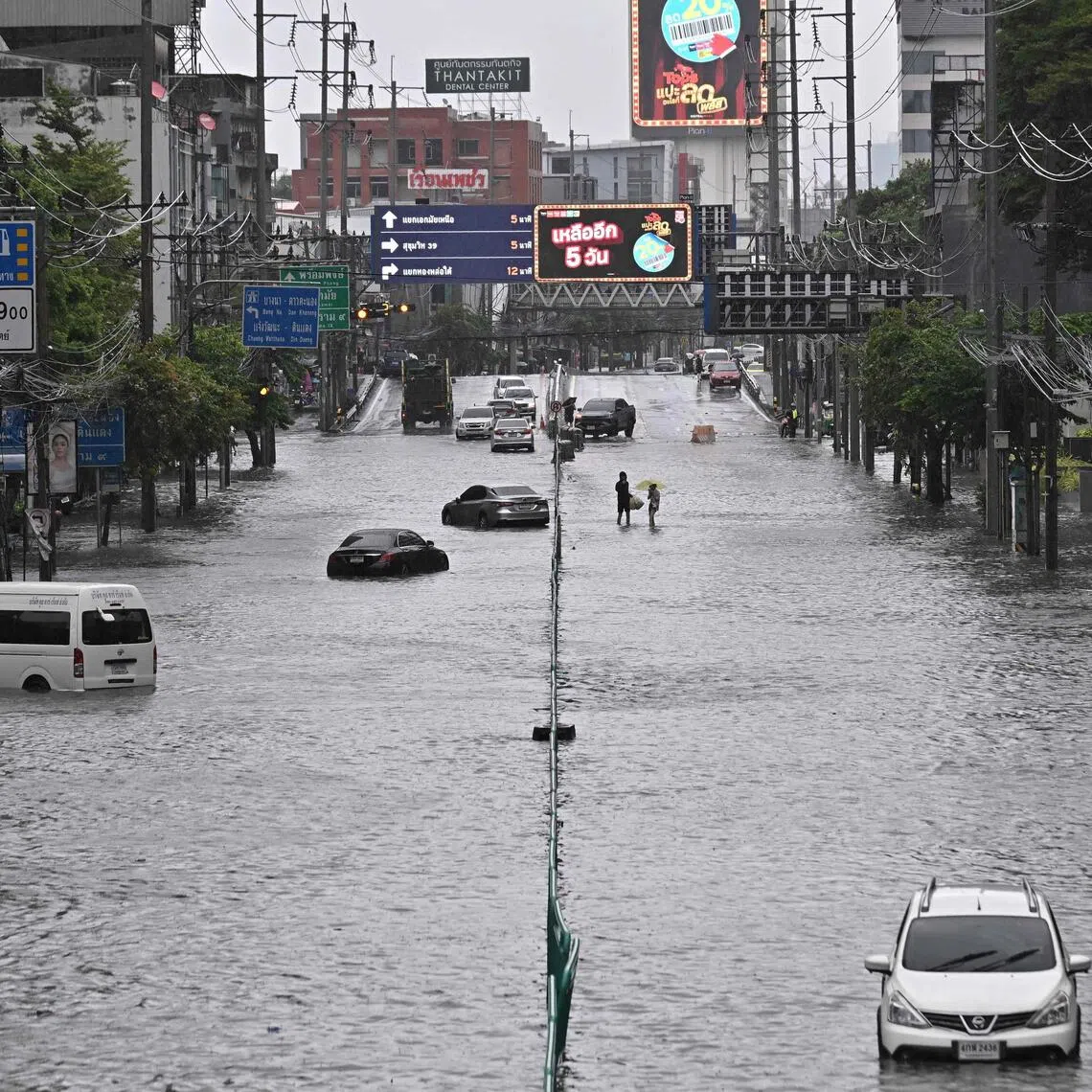 Vehicles are seen stranded in flood waters along Phetchaburi Road in Bangkok on Sept 26.
