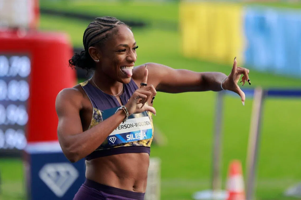 American Melissa Jefferson-Wooden celebrates in front of the cameras after winning the women’s 100 m at the Silesia Diamond League athletics meet in Poland on Aug 23.