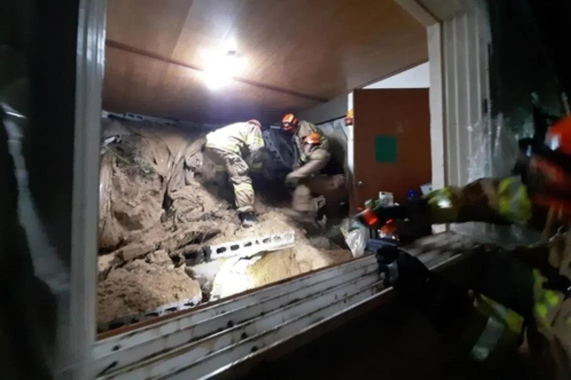 Rescuers pulled to safety nine people in the home when the 10-ton landslide hit.