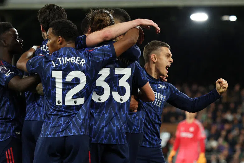 Arsenal's Leandro Trossard celebrates scoring their first goal with teammates.