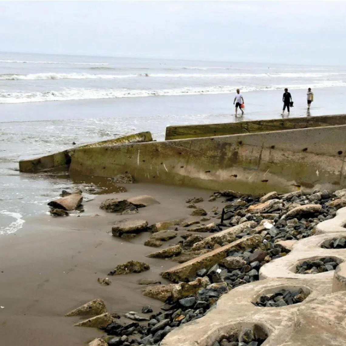 Japan’s Otake Coast Hokota Swimming Beach in June 2024 when it was closed. Sand erosion has stripped away layers of sand on the beach, exposing rocks that used to lie below.