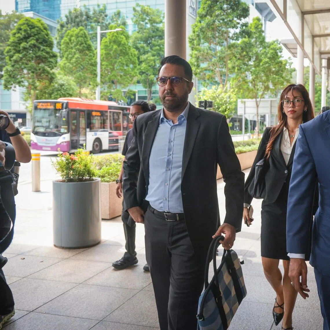 Leader of the Opposition Pritam Singh (left) arriving at the High Court with defence counsel Andre Jumabhoy on Nov 4.