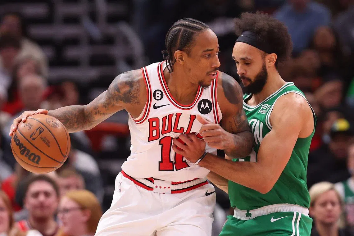 CHICAGO, ILLINOIS - NOVEMBER 21: DeMar DeRozan #11 of the Chicago Bulls drives to the basket against Derrick White #9 of the Boston Celtics during the first half at United Center on November 21, 2022 in Chicago, Illinois. NOTE TO USER: User expressly acknowledges and agrees that, by downloading and or using this photograph, User is consenting to the terms and conditions of the Getty Images License Agreement.   Michael Reaves/Getty Images/AFP (Photo by Michael Reaves / GETTY IMAGES NORTH AMERICA / Getty Images via AFP)