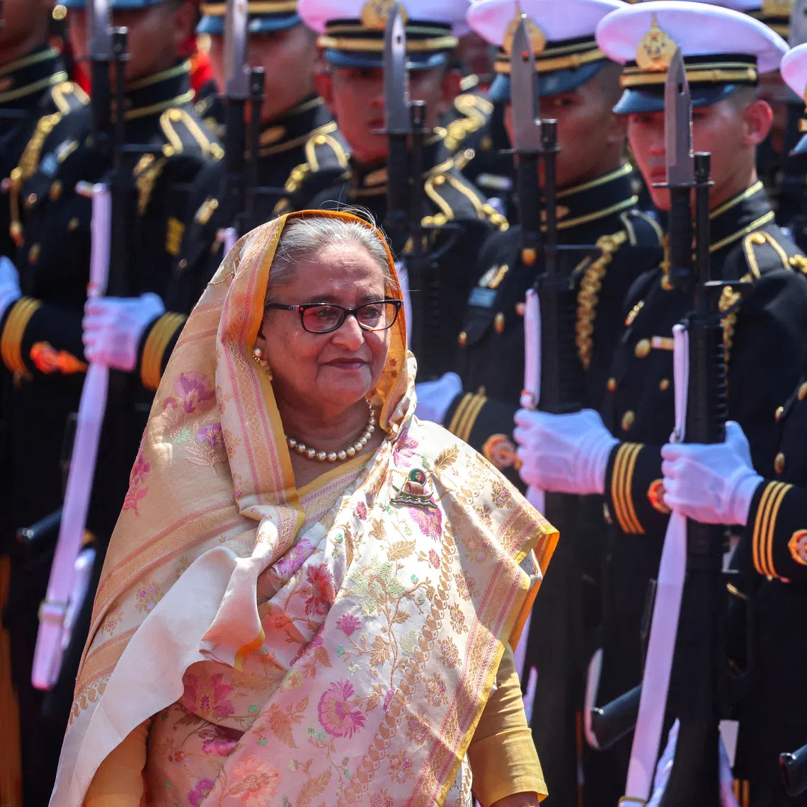 FILE PHOTO: Bangladeshi Prime Minister Sheikh Hasina reviews an honour guard at the Government House, during her visit to Thailand, in Bangkok, Thailand, April 26, 2024. REUTERS/Athit Perawongmetha/File Photo