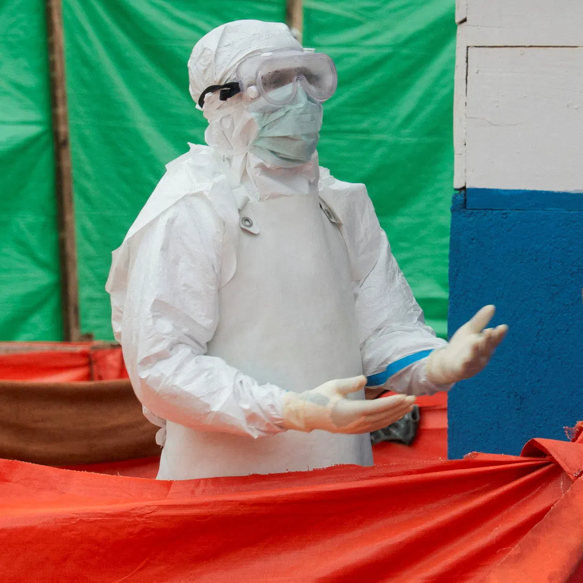 FILE PHOTO: A Congolese medical worker dressed in personal protective equipment (PPE) walks within the emergency unit at the Katwa Ebola treatment center, as aid agencies intensify efforts to contain a new Ebola outbreak involving the Bundibugyo strain in the Mutiri quarter of Butembo, North Kivu province, Democratic Republic of Congo, September 10, 2026. REUTERS/Gradel Muyisa Mumbere/File Photo