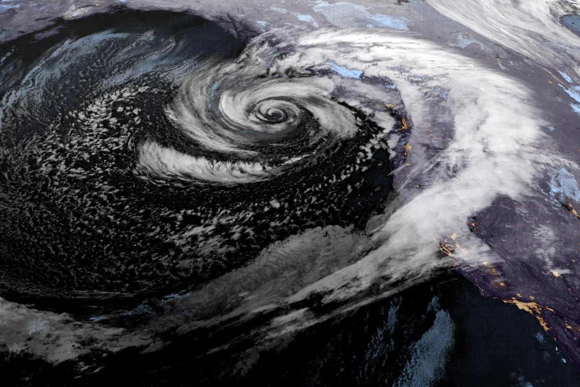A low pressure storm system known as a "bomb cyclone" moves off the coast of the US Pacific Northwest and western Canada in a composite satellite image on Nov 20.
