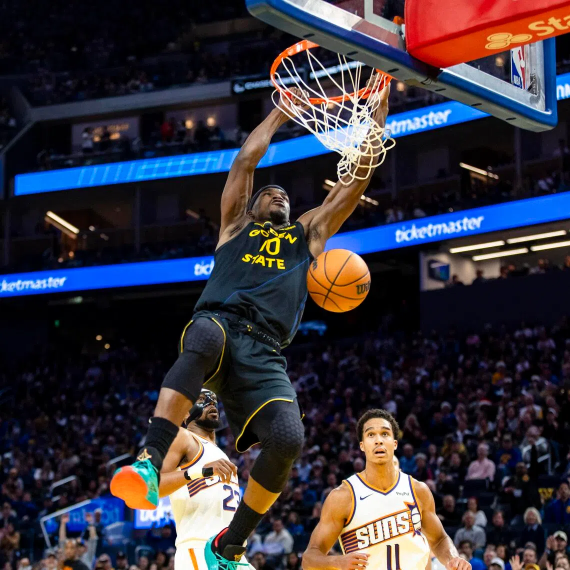 Golden State Warriors forward Jimmy Butler dunks the ball against the Phoenix Suns during the third quarter at Chase Center.