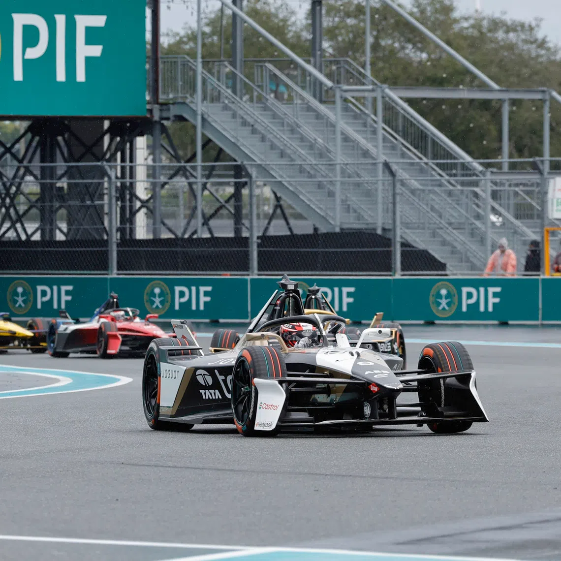 Jan 31, 2026; Miami Gardens, Florida, USA;  Jaguar Racing driver Mitch Evans (9) leads the pack into turn four during the E Prix race at Miami International Autodrome at Hard Rock Stadium. Mandatory Credit: Reinhold Matay-Imagn Images