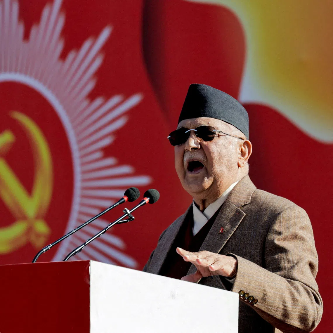 FILE PHOTO: Former Prime Minister of Nepal K.P Sharma Oli, who was forced to resign after the deadly youth-led protests against corruption in early September this year, addresses his party during a rally, where he called for the restatement of parliament dissolved by his successor Sushila Karki, saying it was unconstitutional, in Kathmandu, Nepal, November 22, 2025. REUTERS/Navesh Chitrakar/File Photo