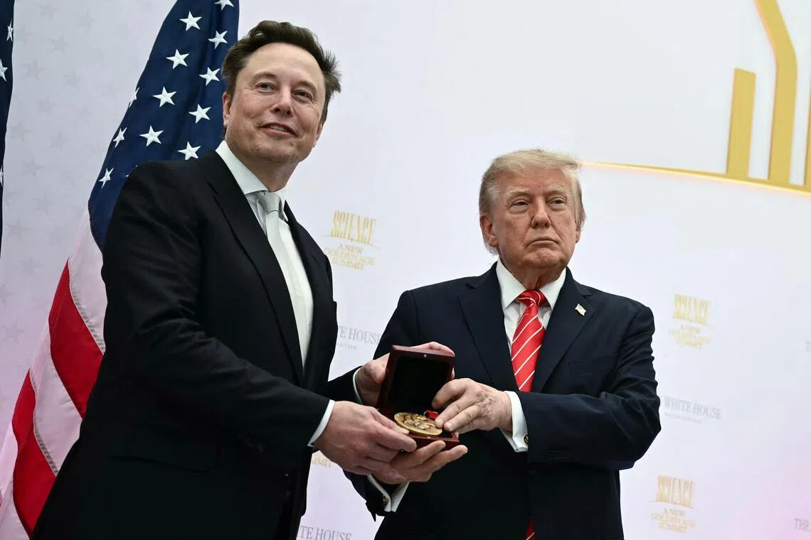 US President Donald Trump presenting the National Medal of Science to Elon Musk during the “Golden Age of American Innovation Summit” on Oct 8.