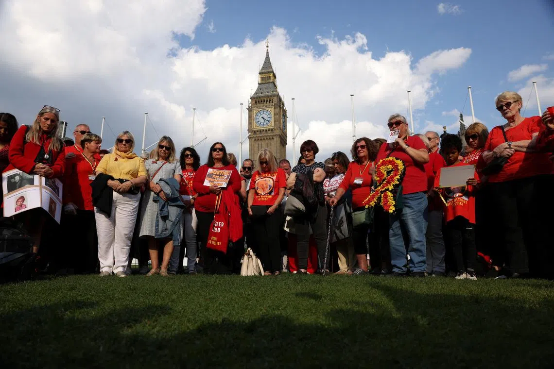 FILE PHOTO: People impacted by the contaminated blood scandal participate in a minute of silence during a vigil to remember those that lost their lives, ahead of the release of final report of the Infected Blood Inquiry on Monday, in London, Britain, May 19, 2024. REUTERS/Hollie Adams/File Photo