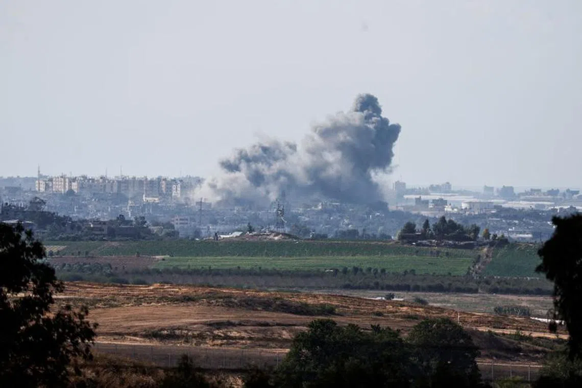 FILE PHOTO: Smoke rises in the air following Israeli bombings in Gaza, as seen from Israel's border with the Gaza Strip, in southern Israel October 15, 2023. REUTERS/Amir Cohen/File Photo