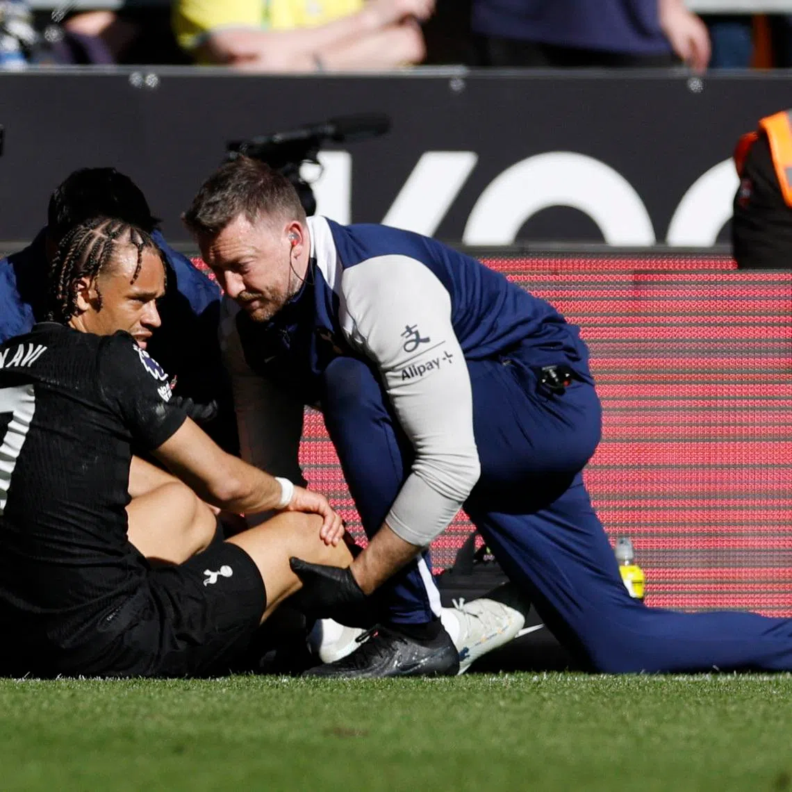 Soccer Football - Premier League - Wolverhampton Wanderers v Tottenham Hotspur - Molineux Stadium, Wolverhampton, Britain - April 25, 2026 Tottenham Hotspur's Xavi Simons receives medical attention after sustaining an injury Action Images via Reuters/Jason Cairnduff