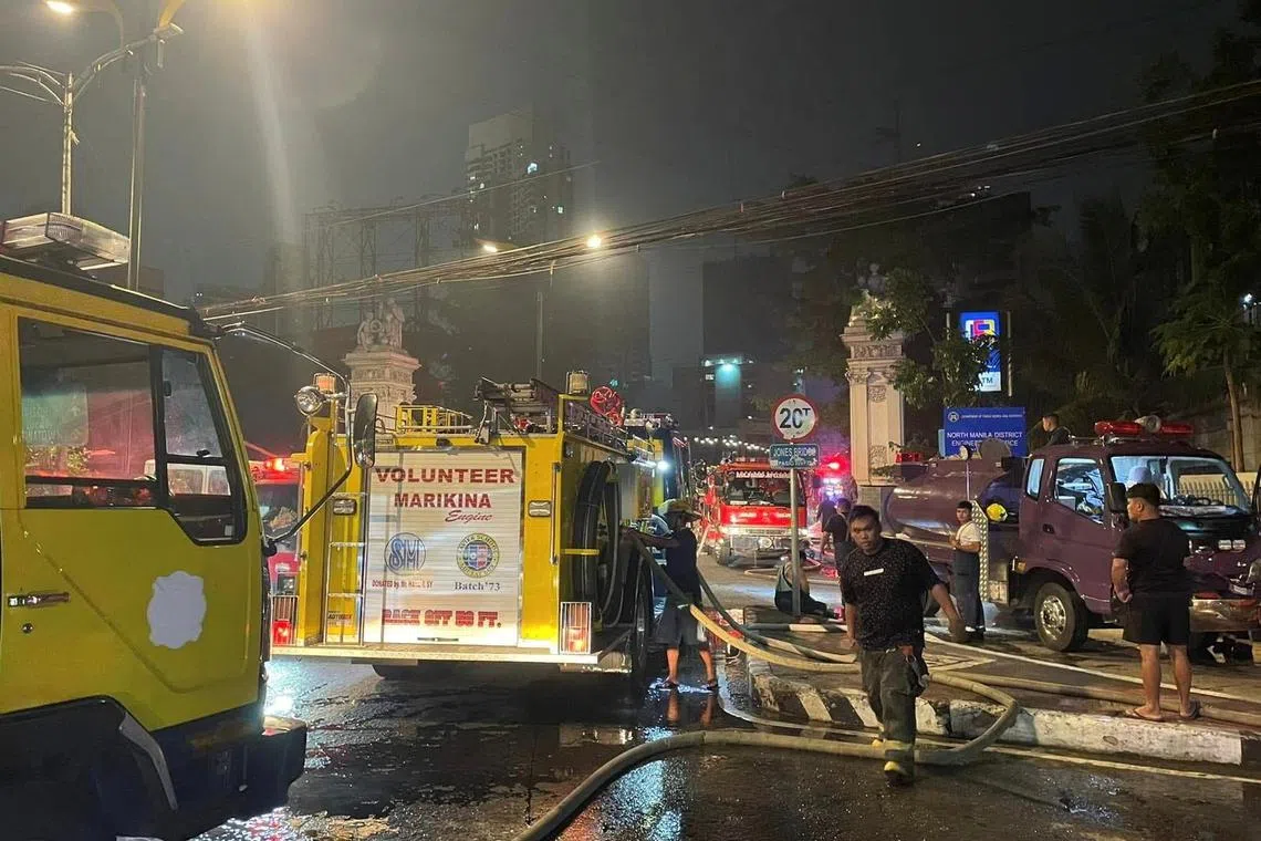 Fire trucks are seen at the scene of a massive fire at the Manila Central Post Office building in Manila, Philippines, May 22, 2023. Marikina Filipino - Chinese Fire Brigade Volunteers/Handout via REUTERS THIS IMAGE HAS BEEN SUPPLIED BY A THIRD PARTY. MANDATORY CREDIT.