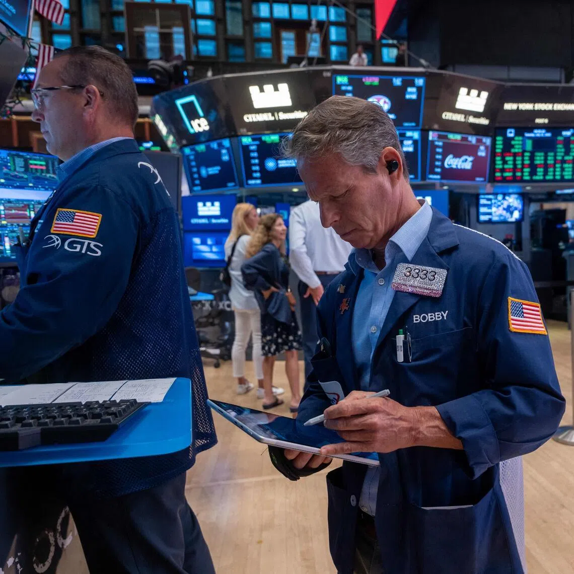 Traders working on the floor of the New York Stock Exchange on July 21, in New York City.