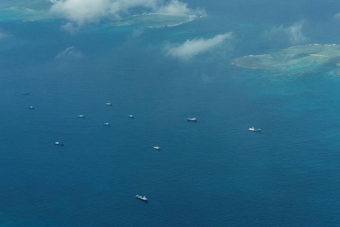 An aerial view of what Philippine Coast Guard alleges were Chinese vessels, manned by Chinese maritime militia loitering within the vicinity of Thitu Island, one of nine features occupied by the Philippines in Spratly Islands, in the disputed South China Sea, March 9, 2023/File Photo