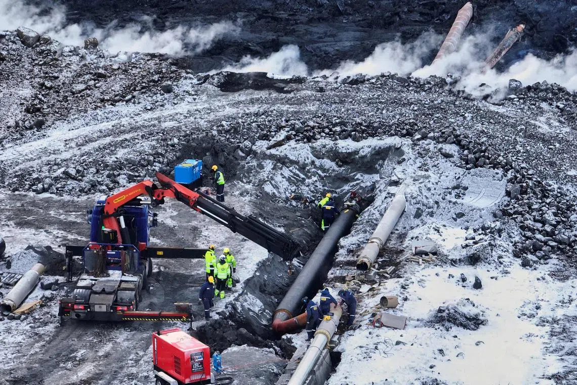 Workers of a geothermal power 
plant working to get hot water supply fixed to thousands of houses on Feb 9.