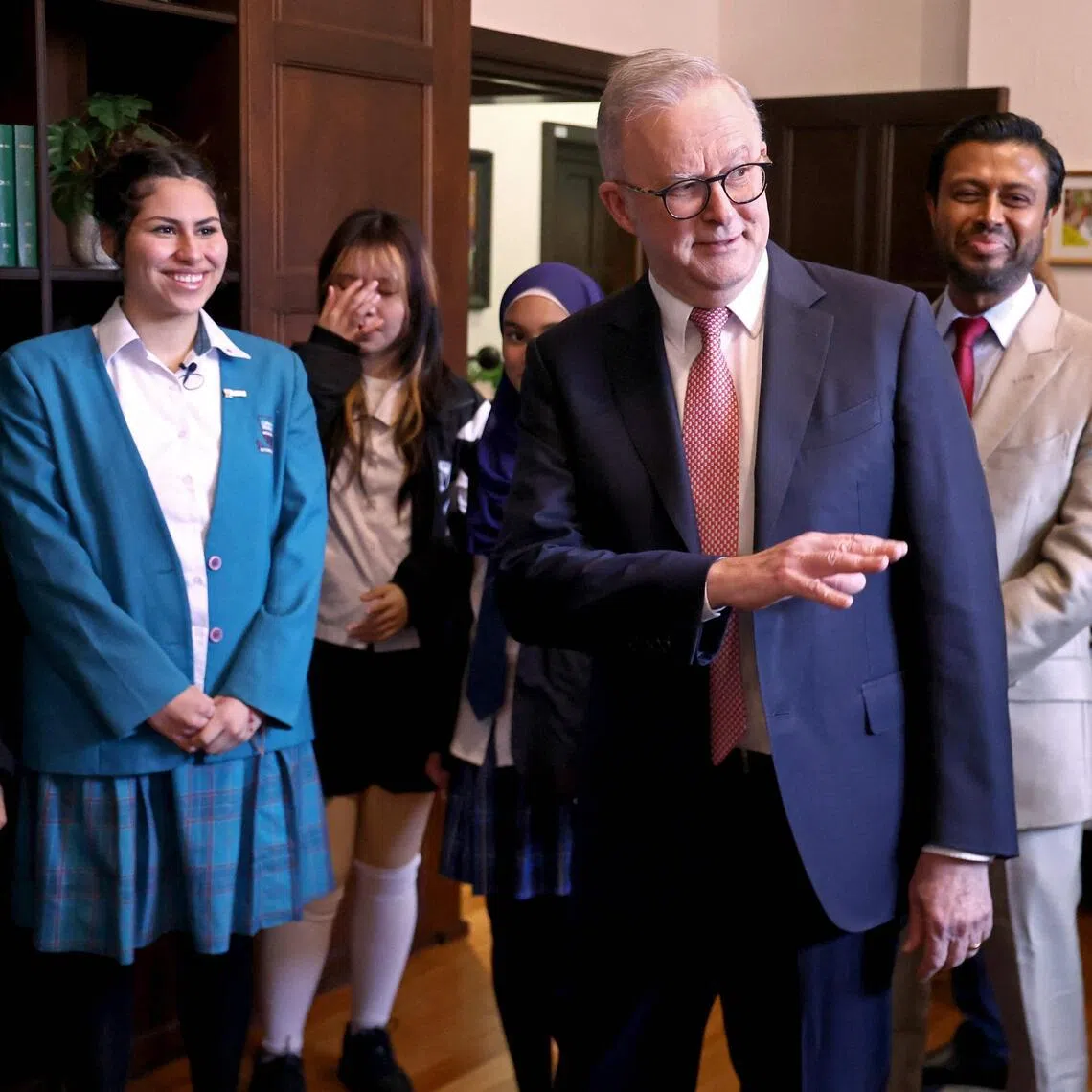 Australia’s Prime Minister Anthony Albanese (centre) speaking with students after event at Sydney University on July 15, 2026.