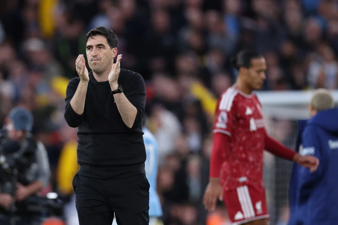 Liverpool manager Andoni Iraola applauds the supporters after his side’s 3-0 defeat to Manchester City, in Liverpool, Britain, on Oct 11.