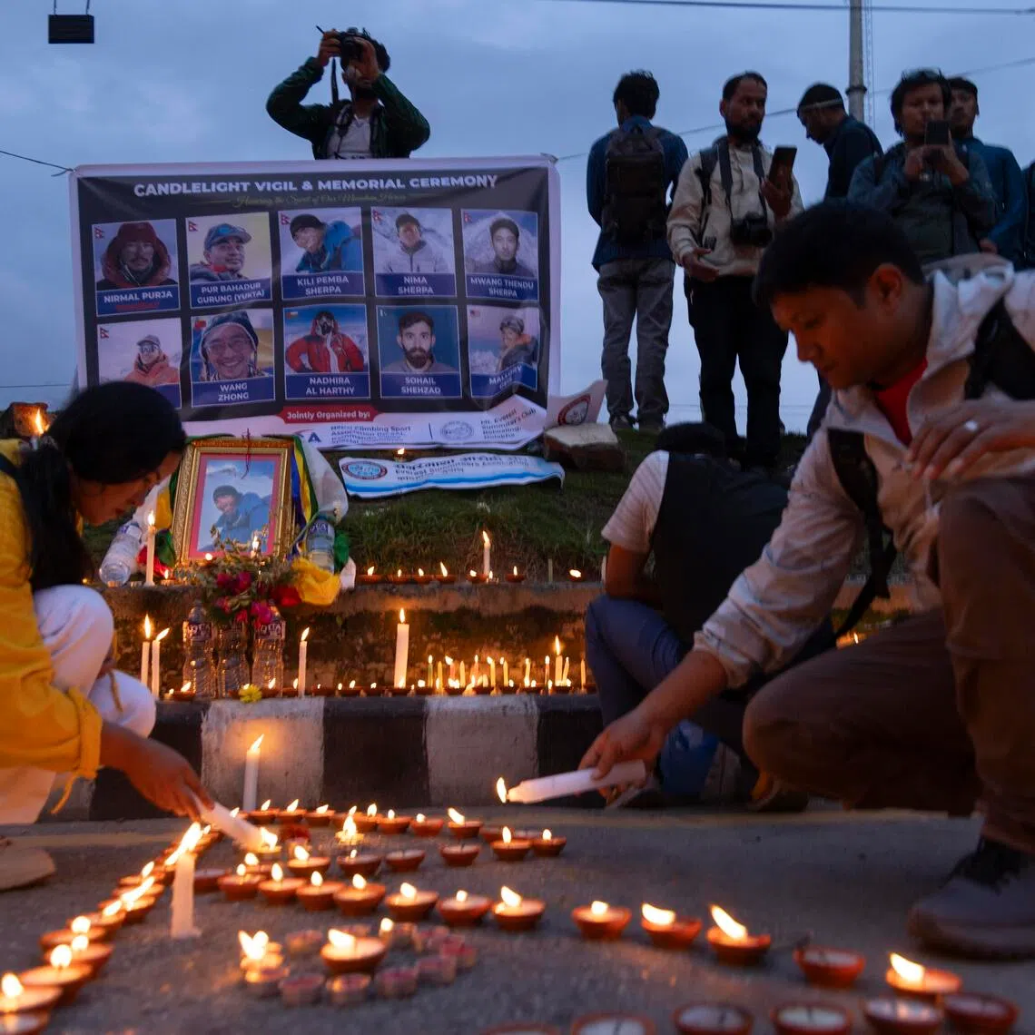 A candlelight vigil in held in Kathmandu on Aug 4 in memory of the 10 climbers killed in an avalanche on Pakistan’s Broad Peak.