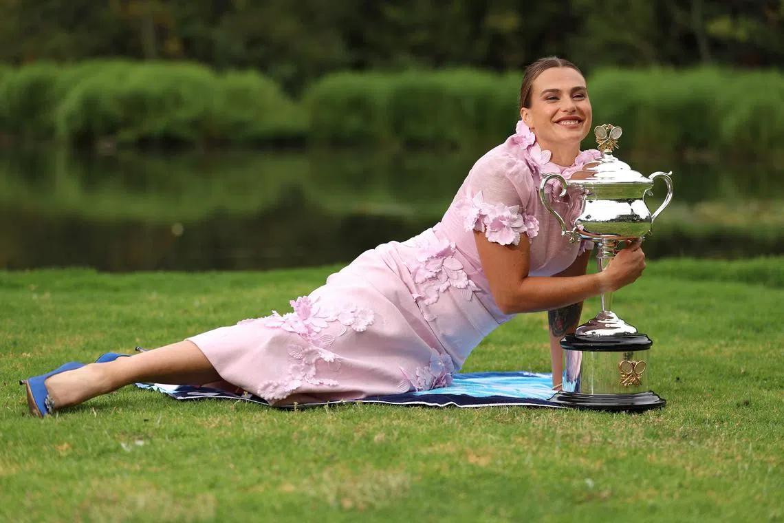 Belarus' Aryna Sabalenka with the Daphne Akhurst Memorial Cup in Melbourne's Royal Botanic Gardens on Jan 29, 2023, following her victory over Kazakhstan's Elena Rybakina.