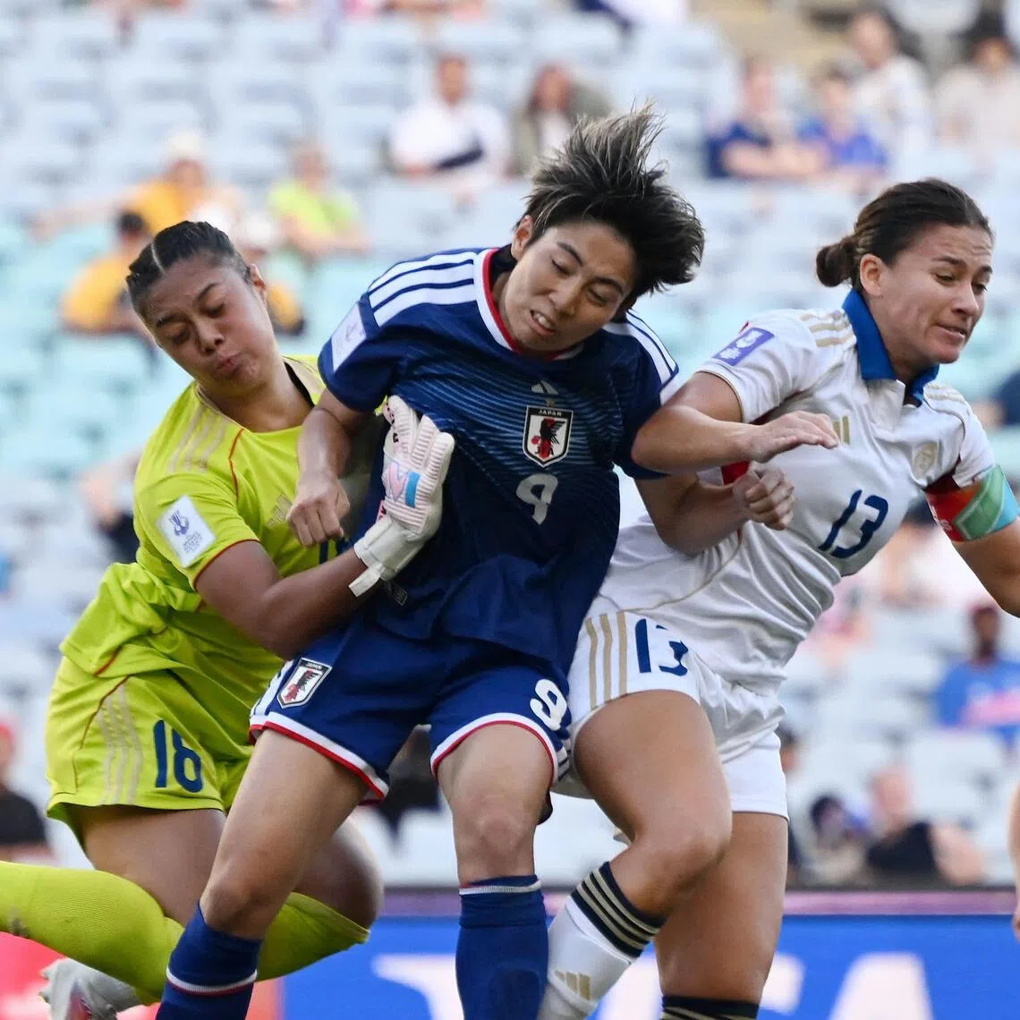 Japan’s Riko Ueki directs a header off the goalpost under pressure from the Philippines’ Angela Beard and goalkeeper Nina Meollo in their AFC Women's Asian Cup football quarter-final at Accor Stadium in Sydney on March 15, 2026.