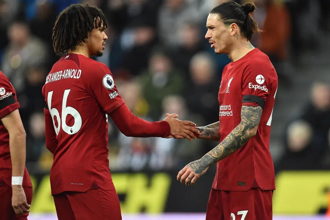 Darwin Nunez (right) celebrates with teammate Trent Alexander-Arnold after scoring Liverpool's opening goal.