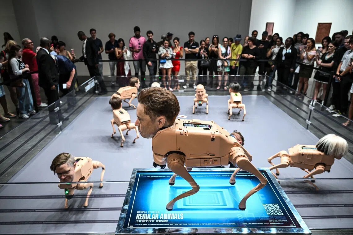 A wax head of Elon Musk on a robot dog, as a part of an art installation called "Regular Animals" by digital artist Mike Winkelmann, also known as Beeple, during Art Basel 2025 at the Miami Beach Convention Center in Miami Beach, Florida, on Dec 7, 2025. 