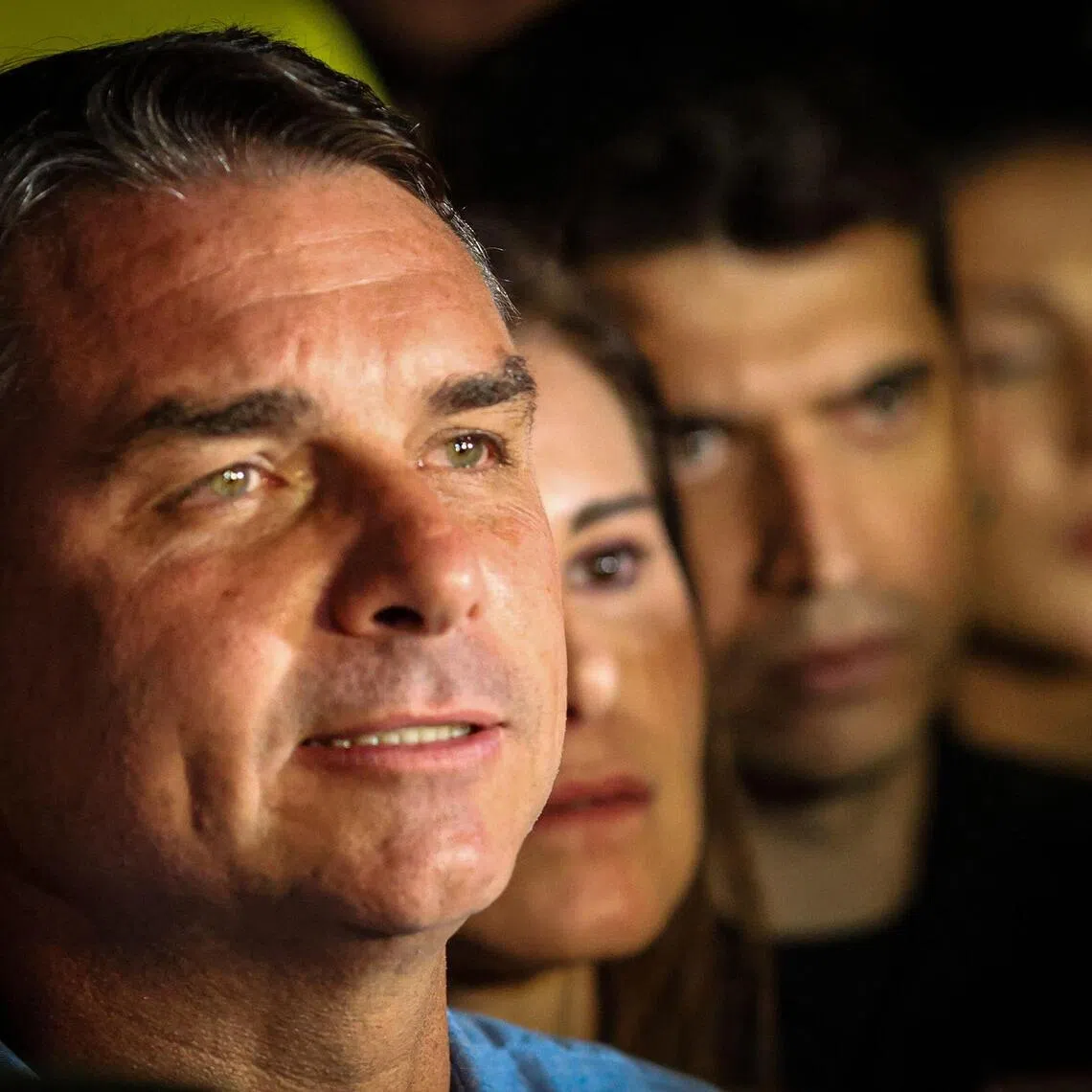 Brazil’s right-wing senator and presidential candidate for the Liberal Party Flavio Bolsonaro speaking to supporters following the partial results of the presidential election in Brasilia on Oct 4.
