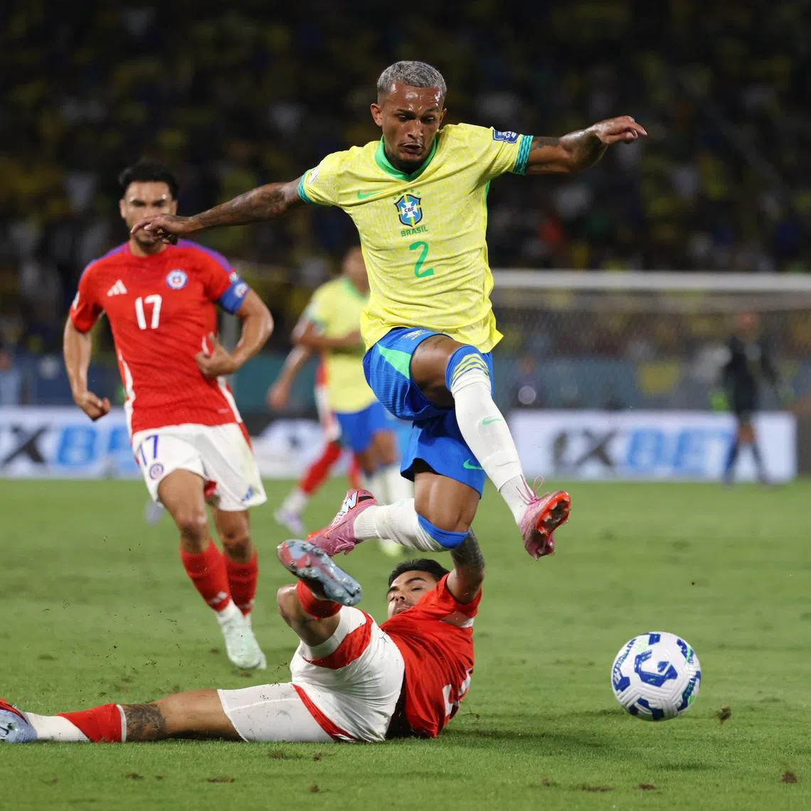 Soccer Football - World Cup - CONMEBOL Qualifiers - Brazil v Chile - Estadio Maracana, Rio de Janeiro, Brazil - September 4, 2025 Brazil's Wesley Franca in action with Chile's Guillermo Maripan REUTERS/Sergio Moraes