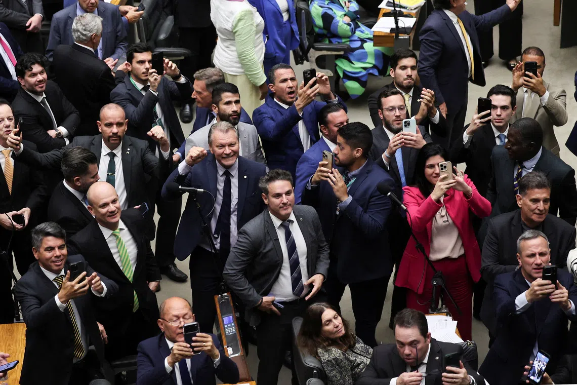 Lawmakers and supporters of former president Jair Bolsonaro celebrating a vote for a Bill, which could slash his prison sentence for plotting a coup, on Dec 10.