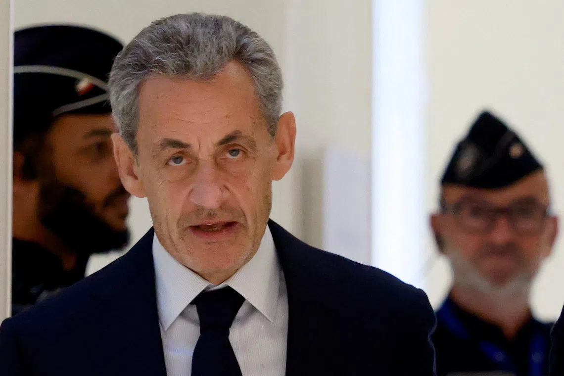 Former French President Nicolas Sarkozy arrives for the verdict in his trial with other defendants on charges of corruption and illegal financing of an election campaign related to alleged Libyan funding of his successful 2007 presidential bid, at the courthouse in Paris, France, September 25, 2025. REUTERS/Stephanie Lecocq/File Photo