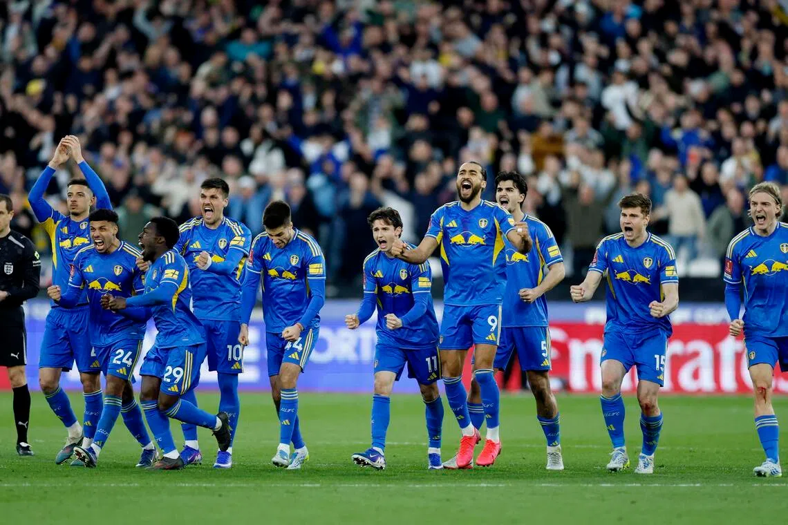 Leeds United players celebrating after winning the penalty shoot-out following their 2-2 draw with West Ham United in the FA Cup quarter-finals at the London Stadium on April 5. 