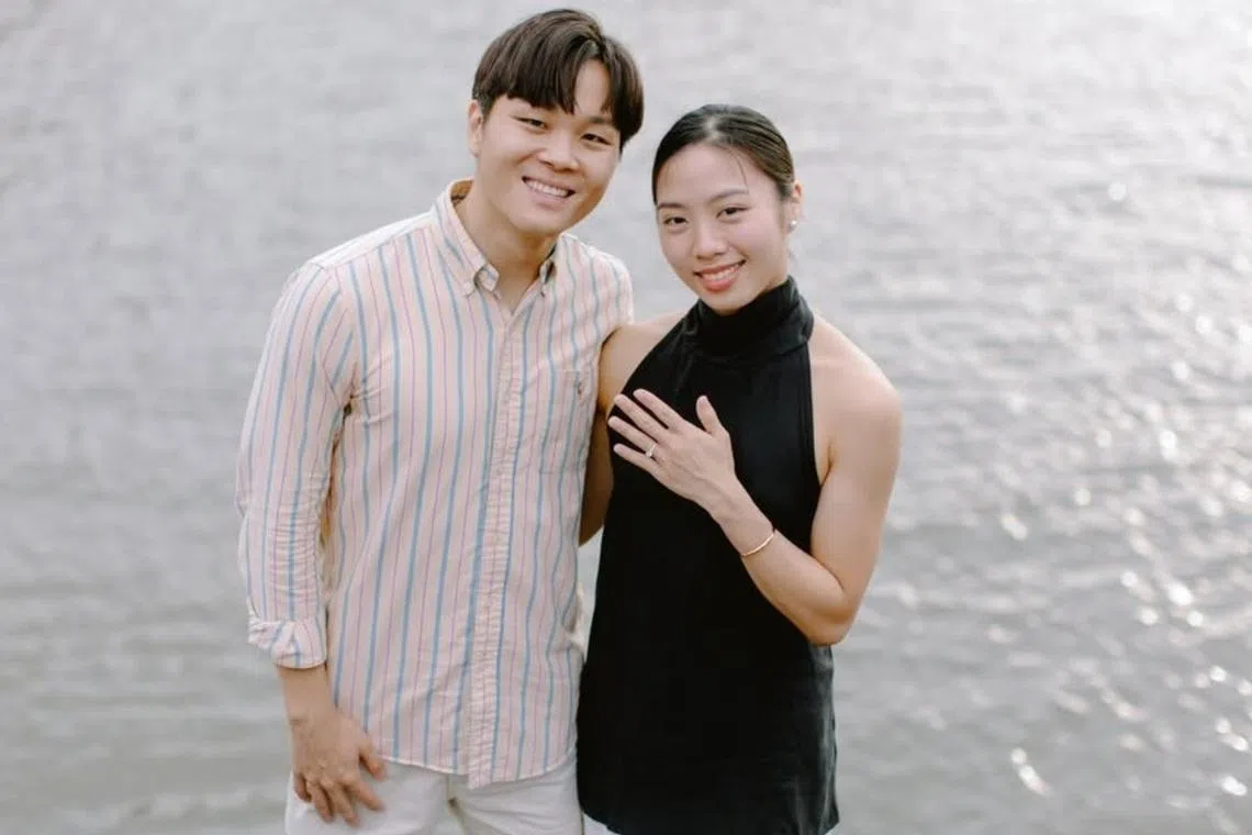 Yeo Jia Min showing a sparkling ring on her ring finger, with Pang Sheng Jun by her side.