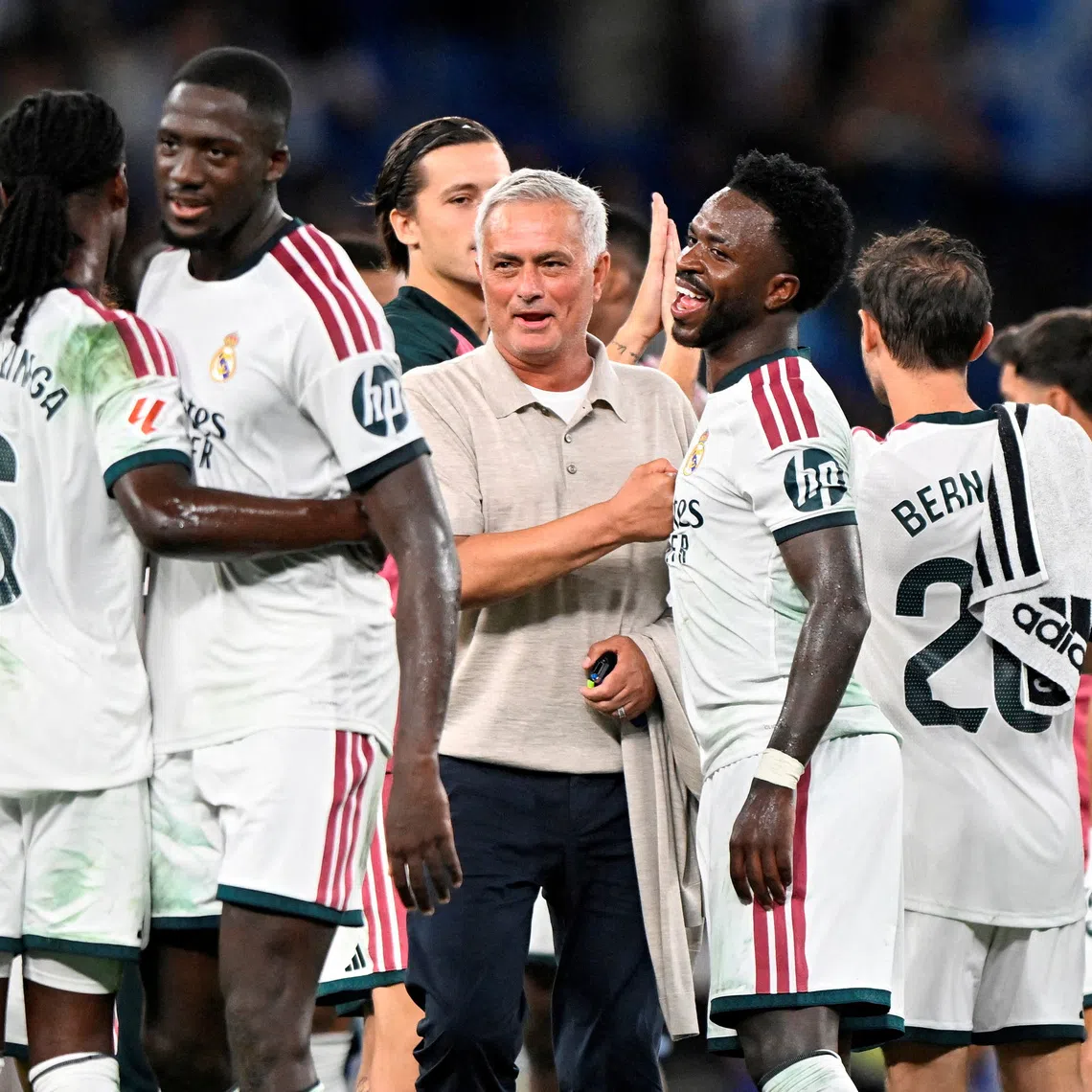 Real Madrid coach Jose Mourinho celebrates after the match with Real Madrid’s Vinicius Junior.