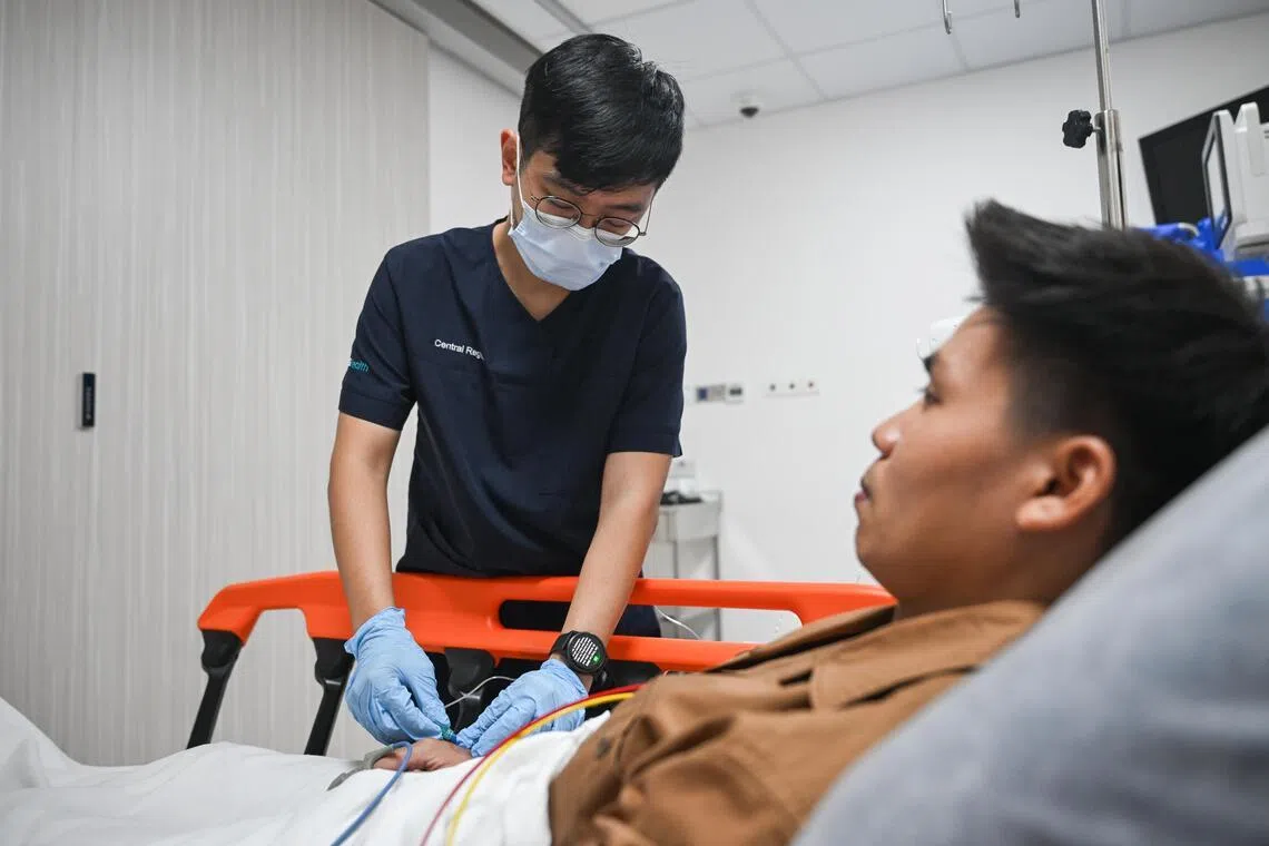 Dr Goh Shih Ee, a consultant in the department of mood and anxiety at the Institute of Mental Health, demonstrating the administration of IV Ketamine on a mock patient on July 1.