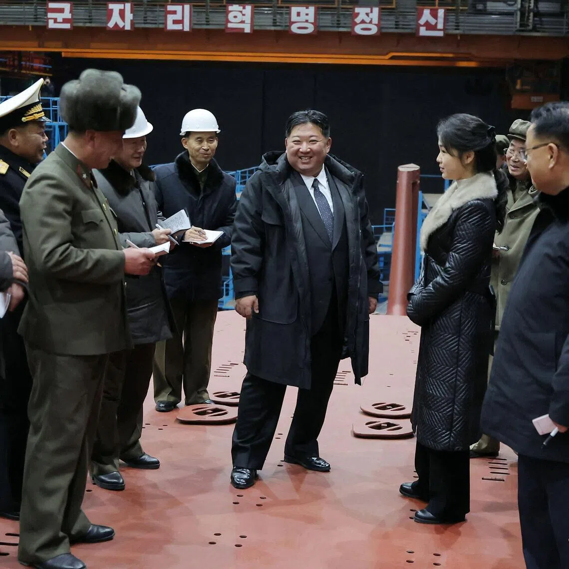North Korean leader Kim Jong Un and his daughter Ju Ae visited the manufacturing site of an 8,700-tonnage nuclear-powered strategic guided missile submarine at an undisclosed location in North Korea. 