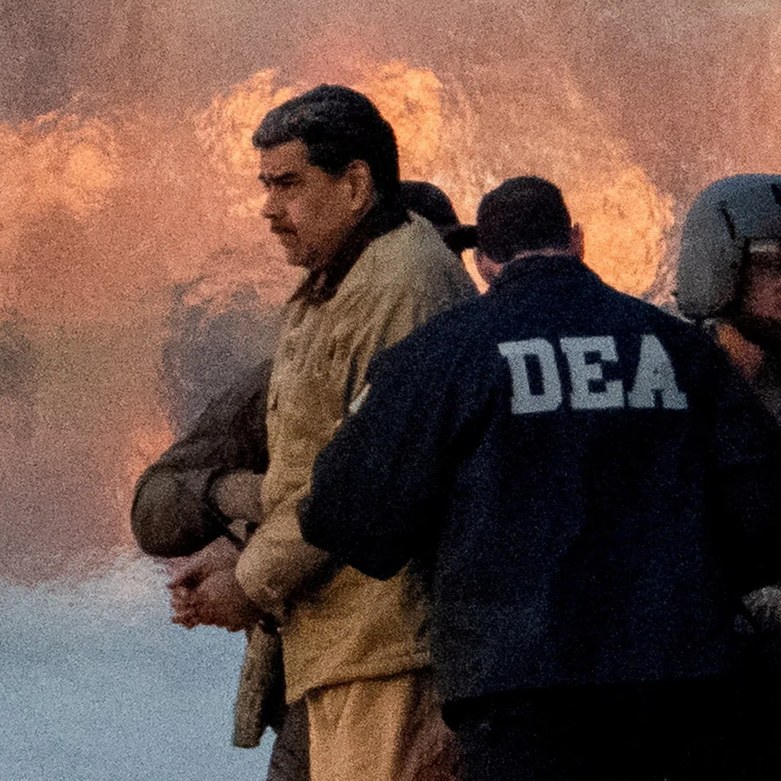 FILE PHOTO: Captured Venezuelan President Nicolas Maduro is escorted, as he heads towards the Daniel Patrick Moynihan United States Courthouse in Manhattan for an initial appearance to face U.S. federal charges including narco-terrorism, conspiracy, drug trafficking, money laundering and others, at Downtown Manhattan Heliport, in New York City, U.S., January 5, 2026. REUTERS/Adam Gray/File Photo