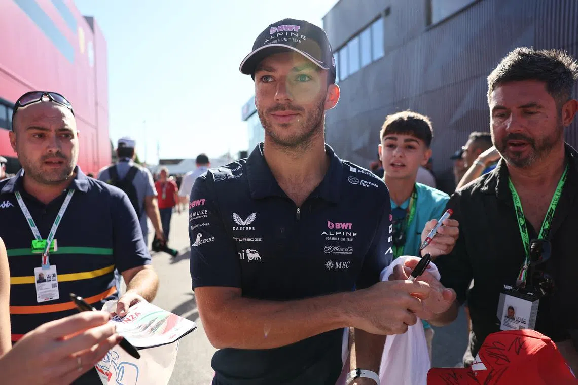 Formula One F1 - Italian Grand Prix - Autodromo Nazionale Monza, Monza, Italy - September 6, 2025 Alpine's Pierre Gasly signs autographs for fans as he arrives ahead of practice REUTERS/Jakub Porzycki
